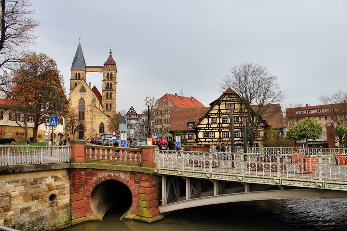 Church and half-timbered houses over a canal in Esslingen