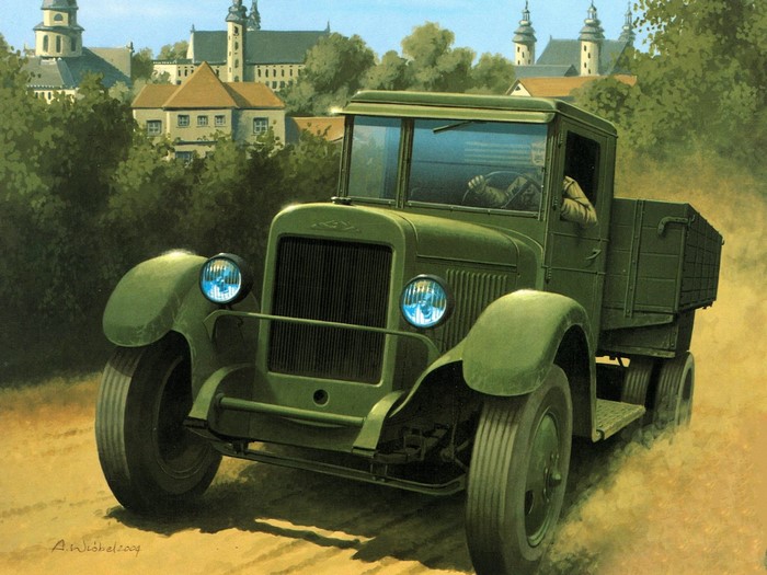 Green military truck driving on a dirt road