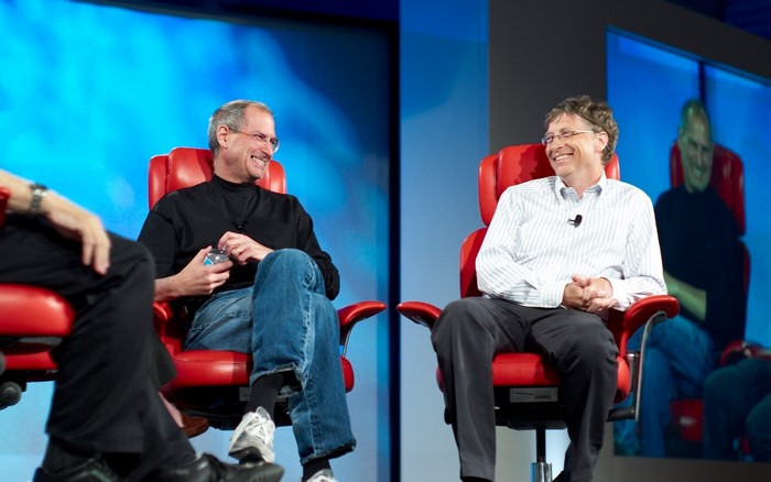 Steve Jobs and Bill Gates sitting on chairs