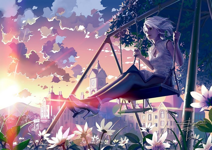 Girl on swing in front of castle at sunset