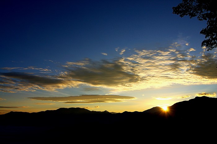 Sunset over mountains with clouds