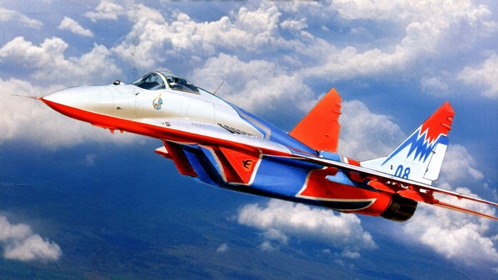 MiG-29 fighter jet in flight with clouds