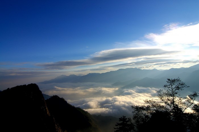 Mountains above a sea of clouds at sunrise