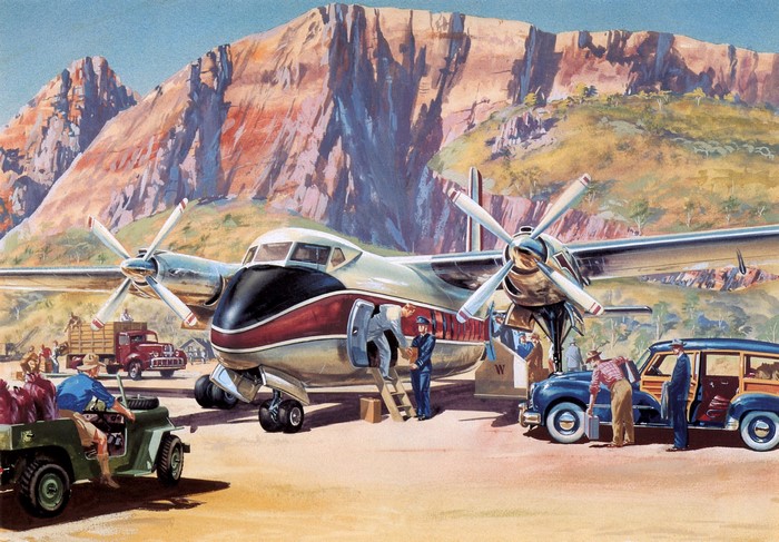 Airplane at a remote airstrip with mountains