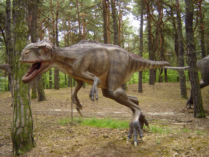 Eotyrannus dinosaur model in a forest setting