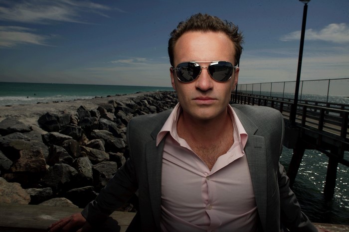 Man in Suit and Sunglasses at the Beach