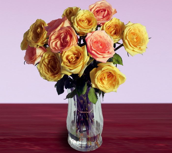 Bouquet of yellow and pink roses in a vase