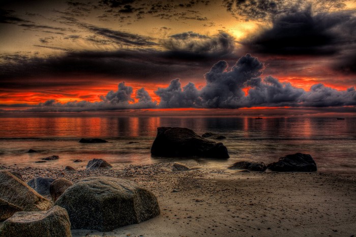 Dramatic sunset over a rocky beach