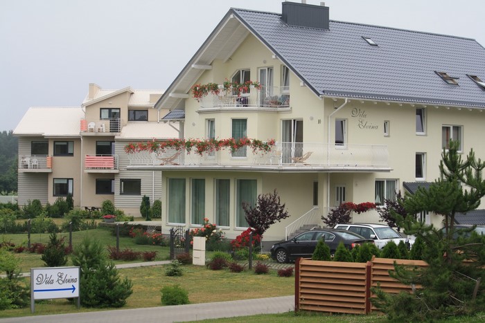 Vila Elvina buildings with cars and greenery