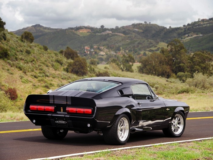 Black Ford Mustang Shelby GT500 on a road