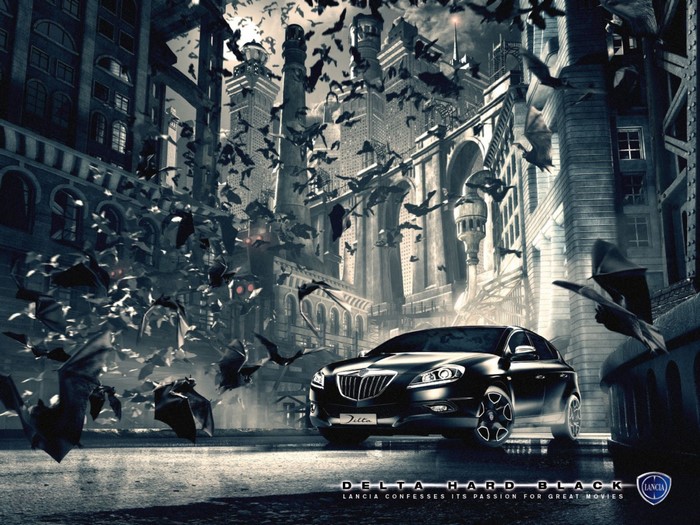 Lancia Delta Hard Black car with bats and gothic buildings