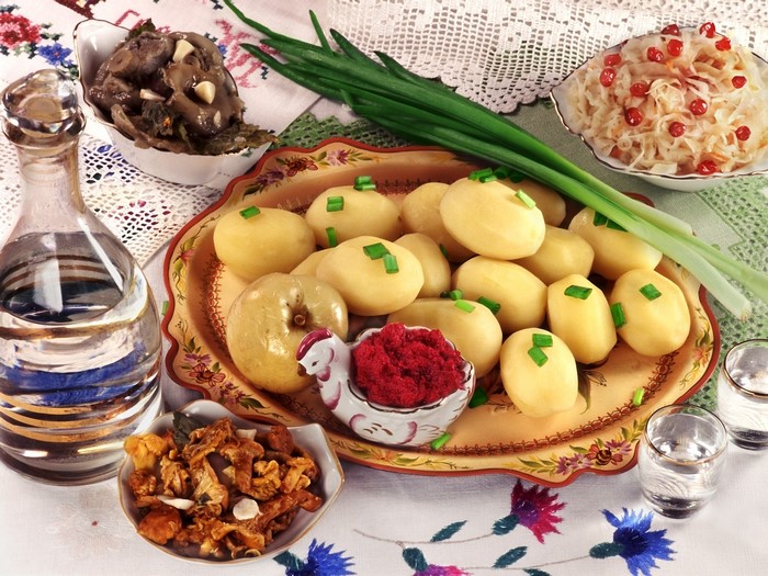 Boiled potatoes with pickled mushrooms and sauerkraut