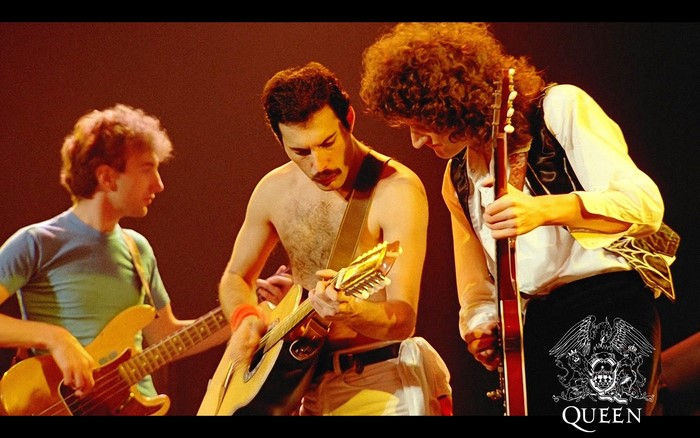 Queen band performing live on stage