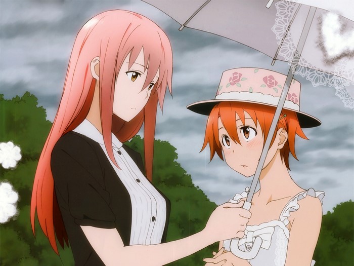 Two girls with an umbrella in the rain