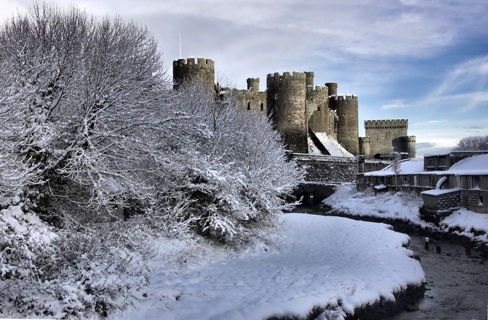 Snowy Caernarfon Castle in Wales