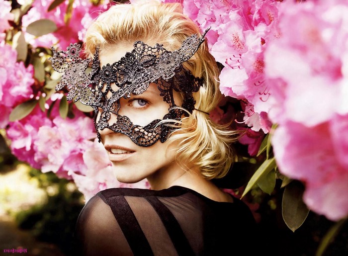 Eva Herzigova wearing a black lace mask