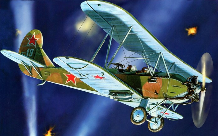 Biplane with red stars in flight during combat