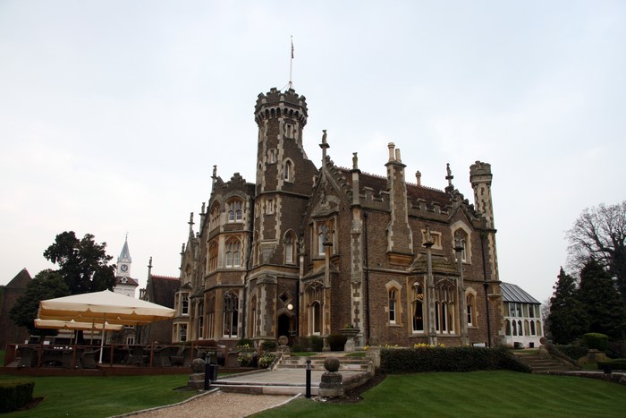 Gothic building with a tower and clock tower in Windsor, United Kingdom