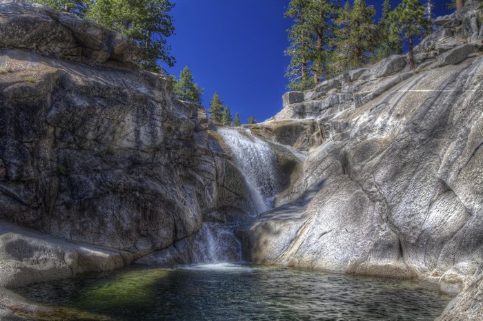 Waterfall cascading over rocks in Yosemite National Park