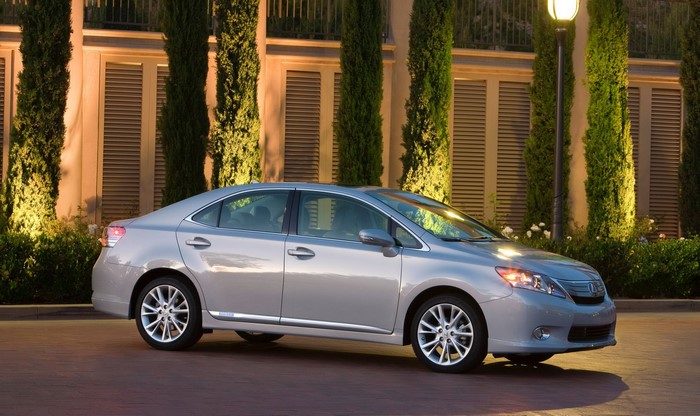 Silver Lexus sedan parked in front of a building