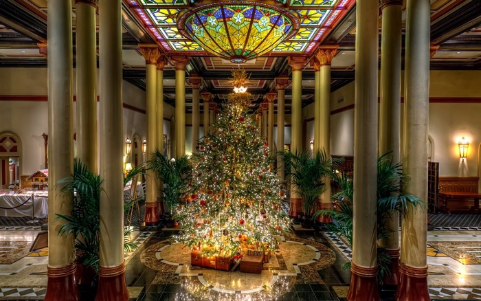 Christmas Tree in a Grand Hall with Stained Glass Ceiling