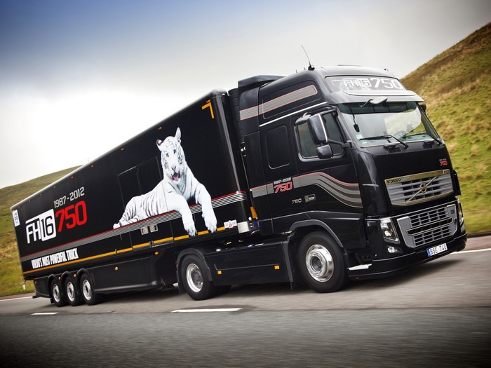 Black Volvo FH16 750 truck with white tiger graphic