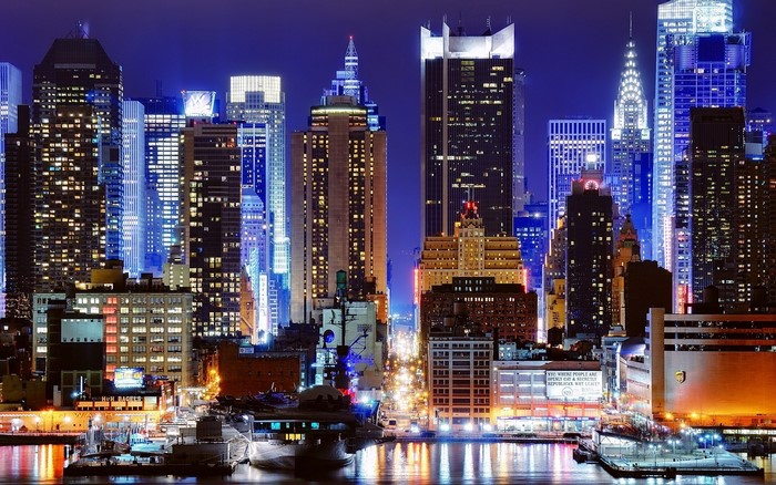 New York City skyline at night with illuminated skyscrapers