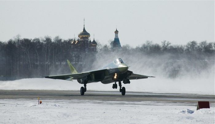 Sukhoi Su-57 fighter jet on a snowy runway