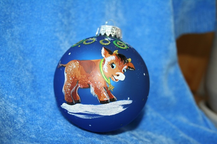Christmas ornament with a painted cow