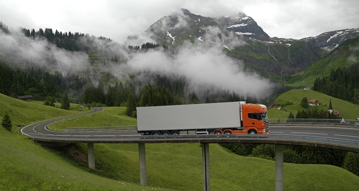 Orange Scania Truck on a Mountain Road