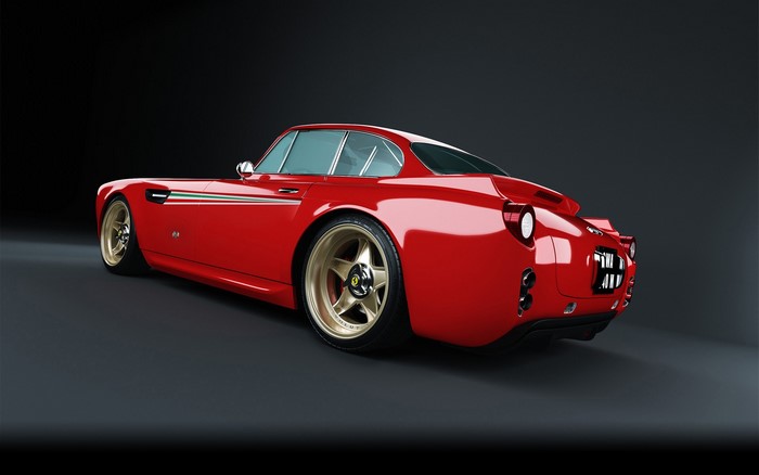 Red Ferrari car with gold rims