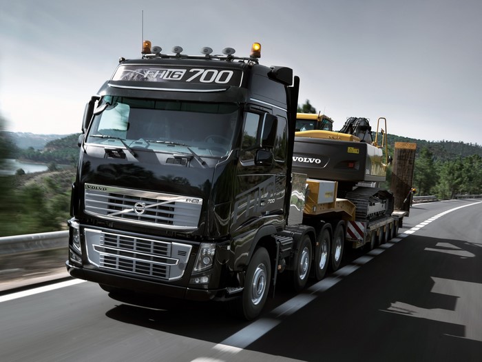 Black Volvo FH16 700 Truck Transporting Excavator