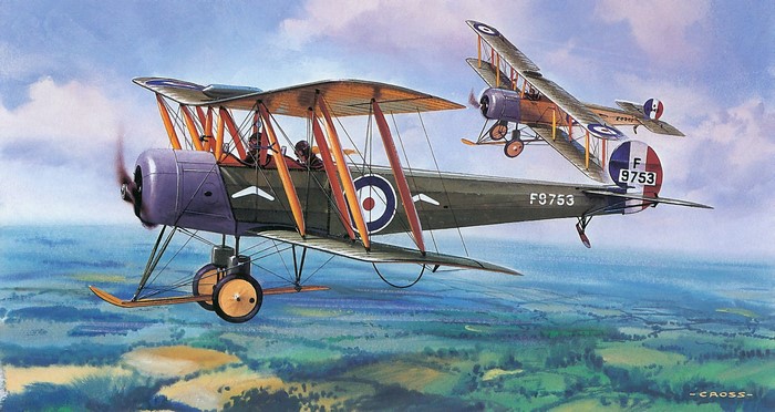 Two biplanes flying over a landscape