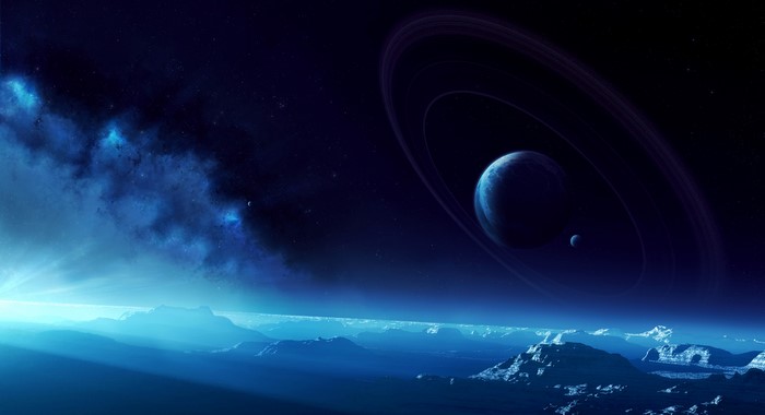Planet with rings and moons over alien landscape