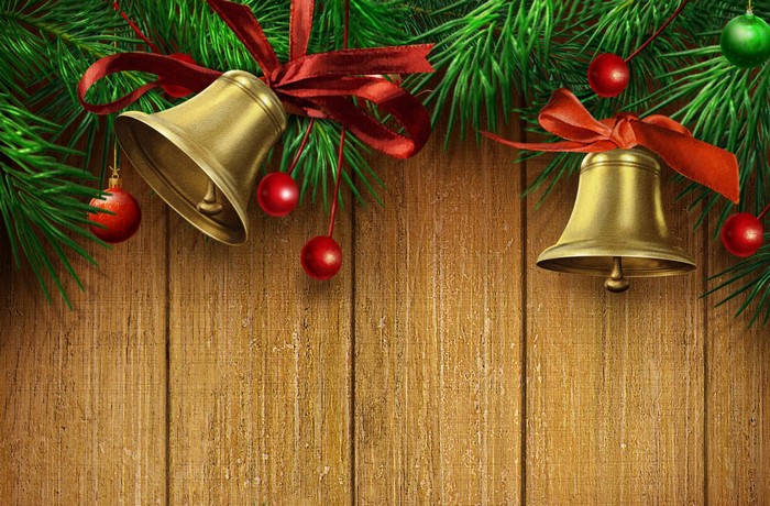 Christmas Bells and Ornaments on Wooden Background