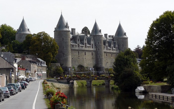 Castle in France with a river and town