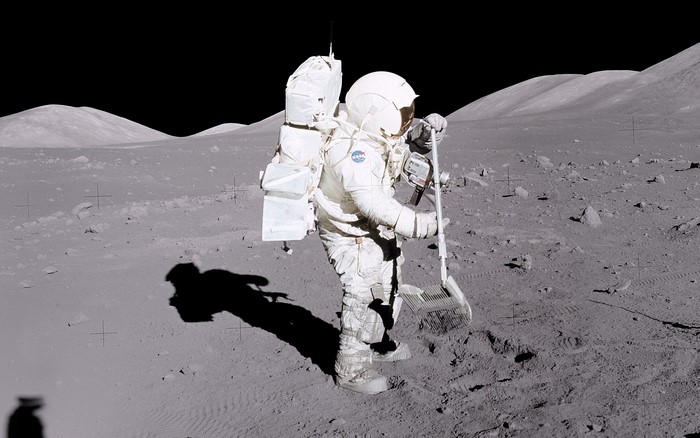 Astronaut on the Moon with a broom