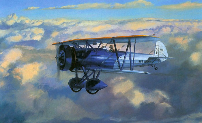 US Navy Biplane Flying Through Clouds