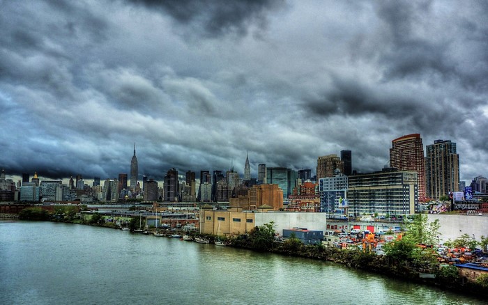 New York City skyline under stormy clouds