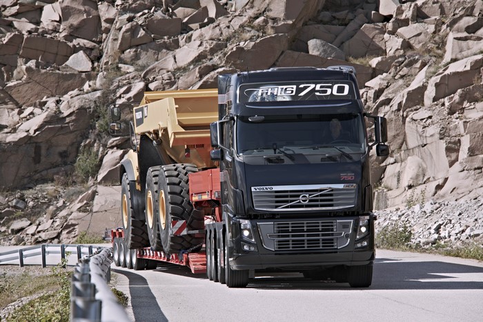 Volvo FH16 750 truck transporting a dump truck