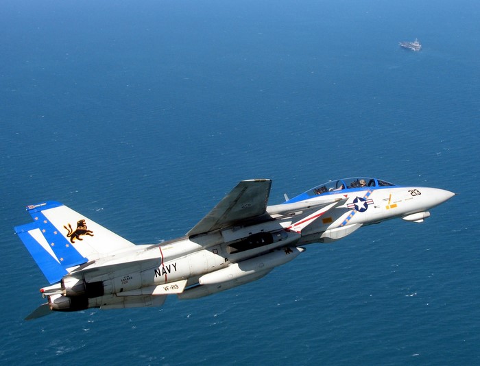 F-14D Tomcat fighter jet flying over the ocean