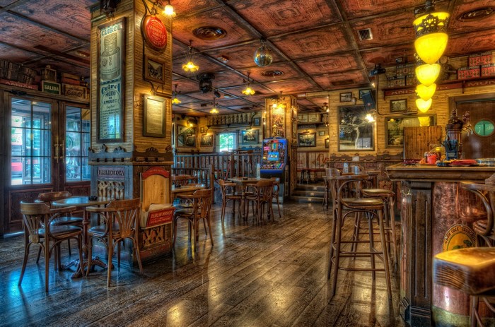 Interior of a rustic bar with wooden furniture and decor