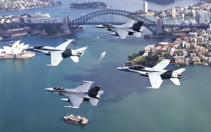 Fighter jets fly over Sydney Harbour with Opera House and Harbour Bridge