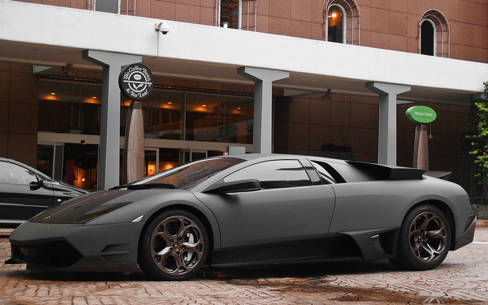 Matte gray Lamborghini parked outside The Coffee Bean