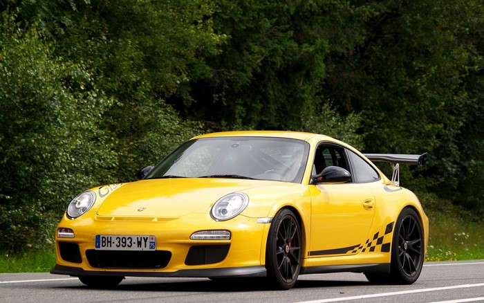 Yellow Porsche 911 GT3 RS with racing decals