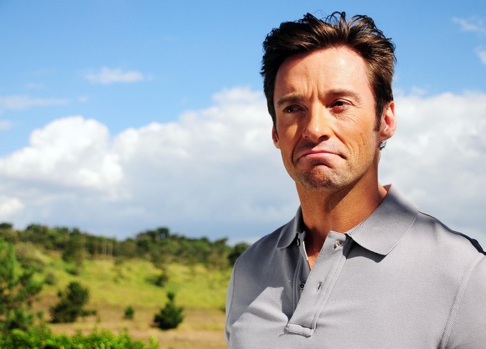 Hugh Jackman wearing a grey polo shirt
