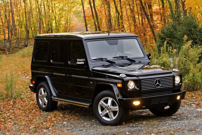 Black Mercedes-Benz G-Class SUV in Autumn Forest