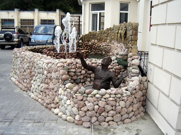Fountain sculpture with bronze figure in Volgograd