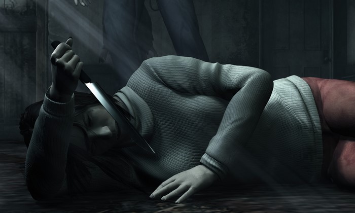 Woman lying on the floor with a knife