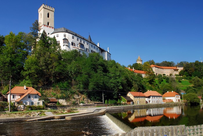 Castle on a hill above a river in Czech Republic